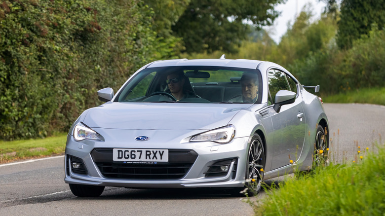 2017 silver Subaru BRZ car travelling on an English country road