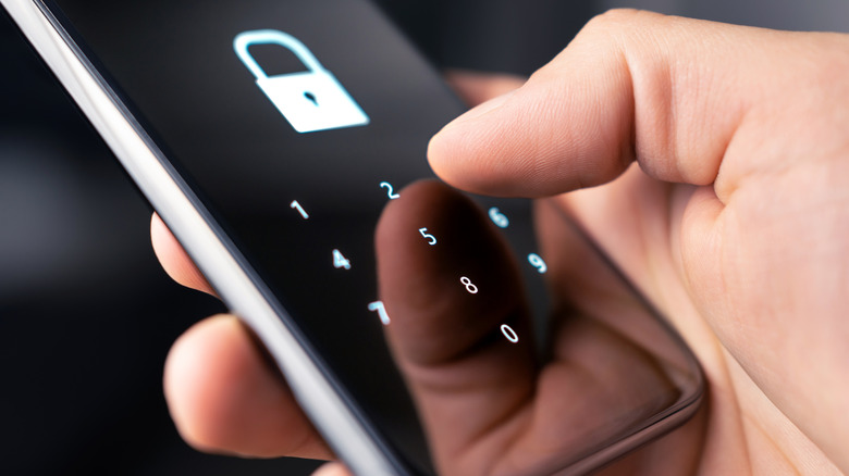 Person inputting phone passcode