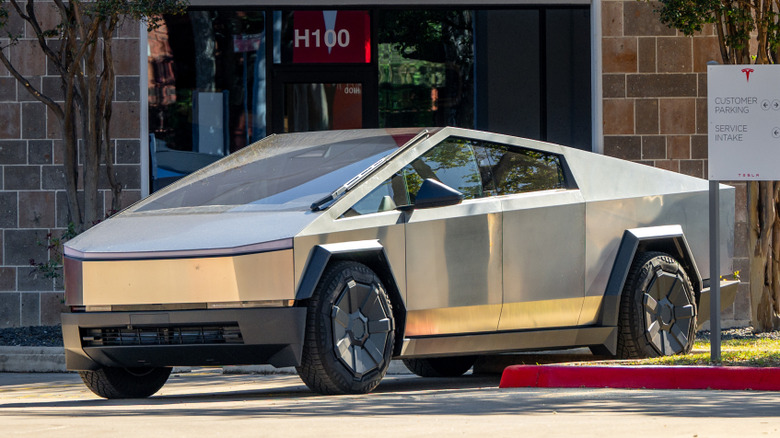 A Cybertruck outside a Tesla dealership
