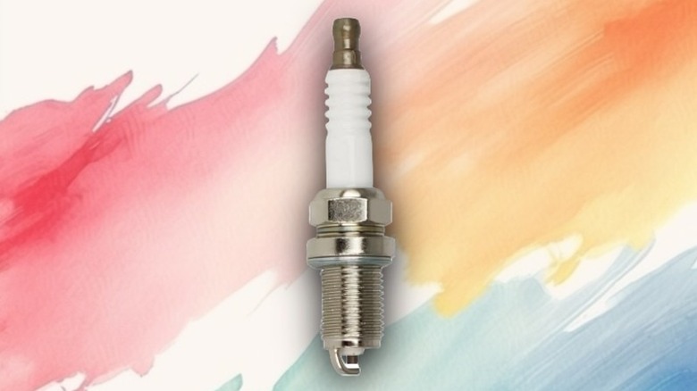 A copper spark plug on a painted background.