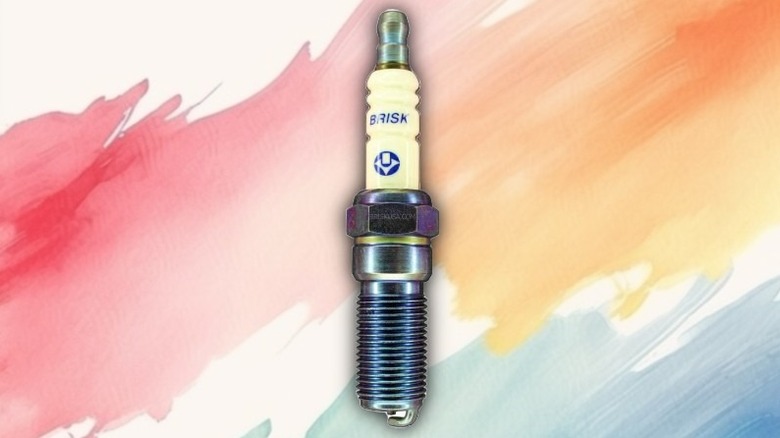 A silver spark plug on a painted background.