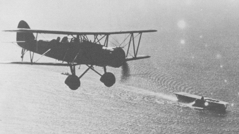 Type 96 plane flying over the aircraft carrier Kaga in 1937/1938