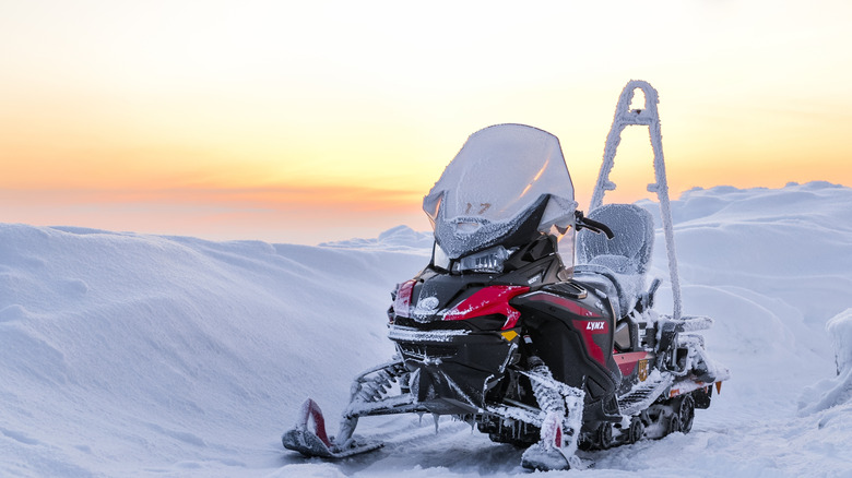 Lynx snowmobile in front of snowy landscape