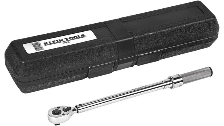 A Klein brand torque wrench next to a carrying case