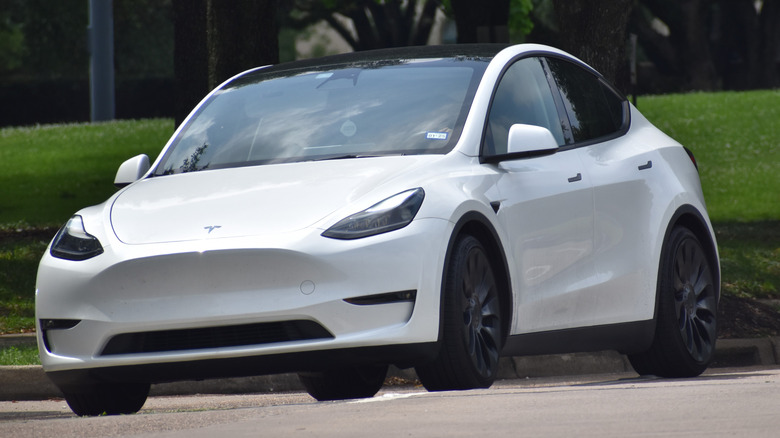 A white Tesla Model Y parked