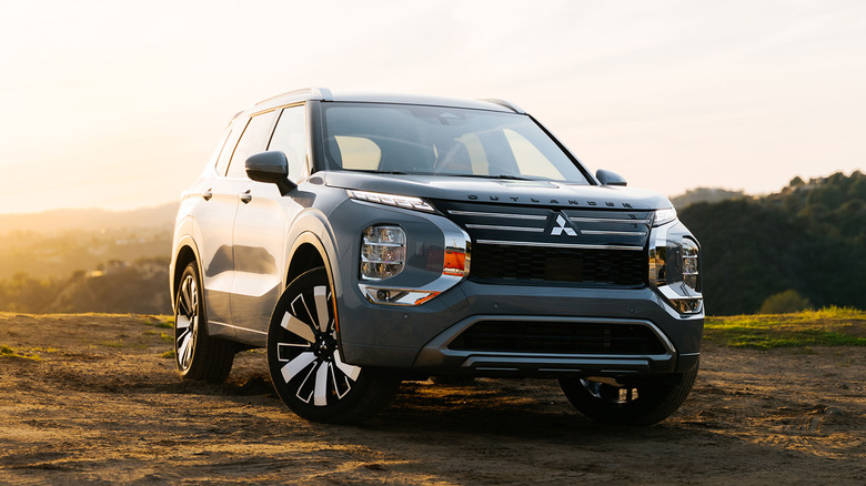 A gray Mitsubishi Outlander parked