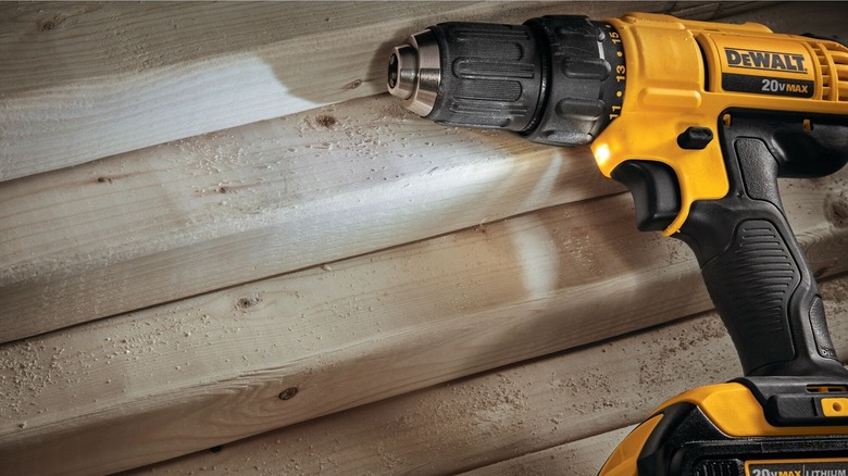 DeWalt compact drill on wooden floor