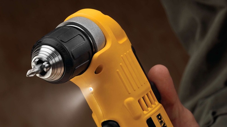 Person holding DeWalt right angle drill