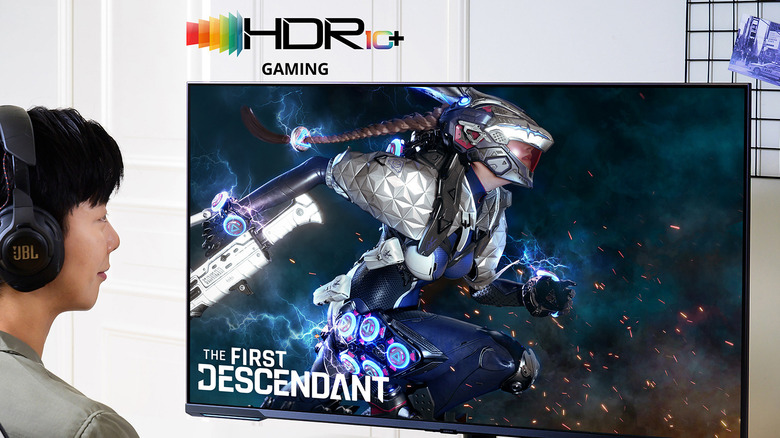 HDR10+ promotional image showing a person playing The First Descendant videogame on a TV.