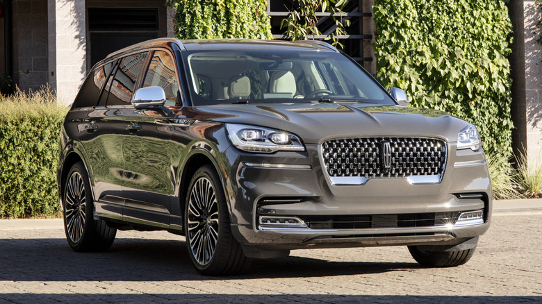 Gray Lincoln Aviator parked in front of a house
