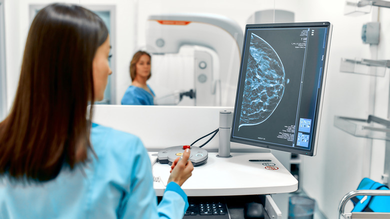 looking at patient's mamogram