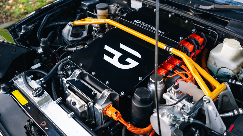 Engine bay showing battery of Electrogenic EV conversion of NA Miata