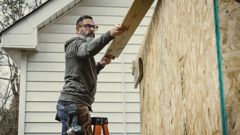 A person building a shed