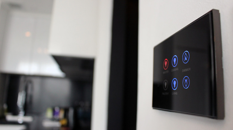Wall mounted smart light control touchscreen with different rooms and dimmer setting