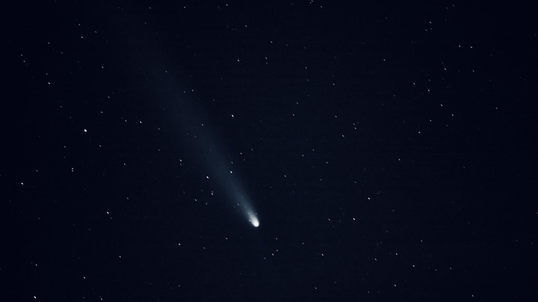 A bright comet in a starry sky.