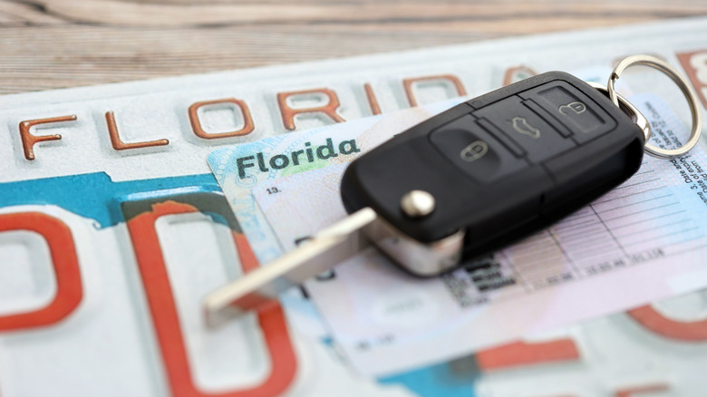 A car key on a Florida license plate.