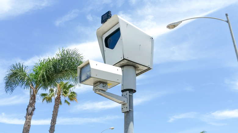 A speed camera on the side of the road