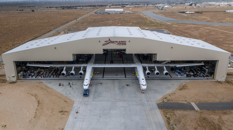 Roc aircraft leaving a massive hangar