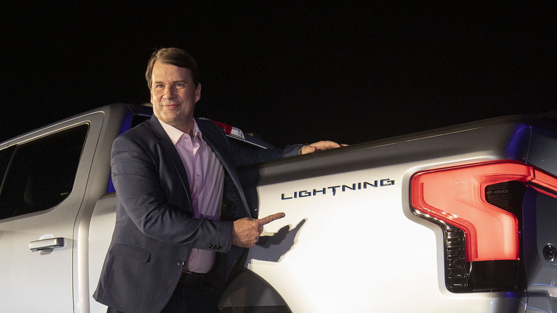 Jim Farley, CEO of Ford Motor Company, poses with the F-150 Lightning