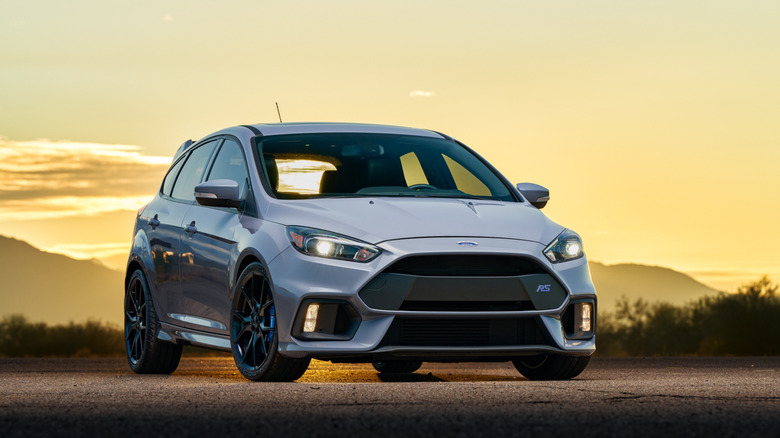 Ford Focus hatchback parked at sunset