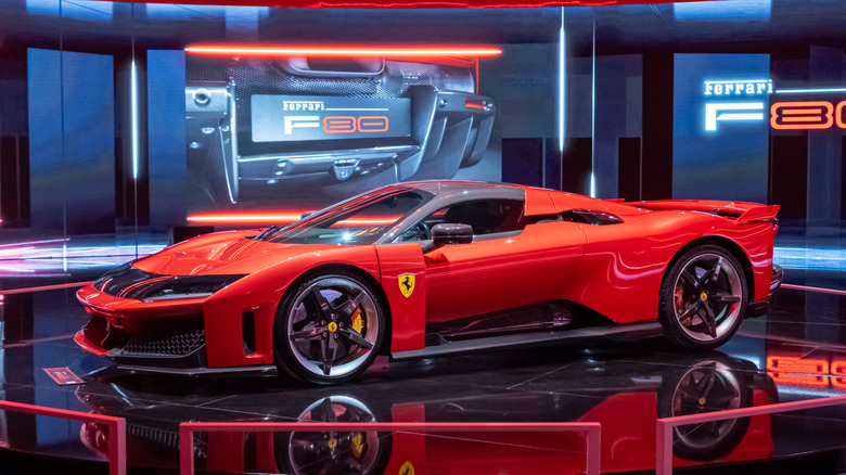 A red Ferrari F80 hypercar on display.