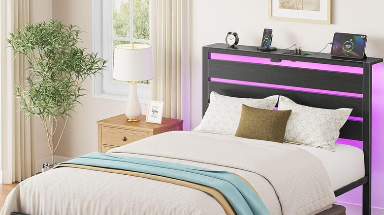 Bed frame with purple LEDs and integrated charging station