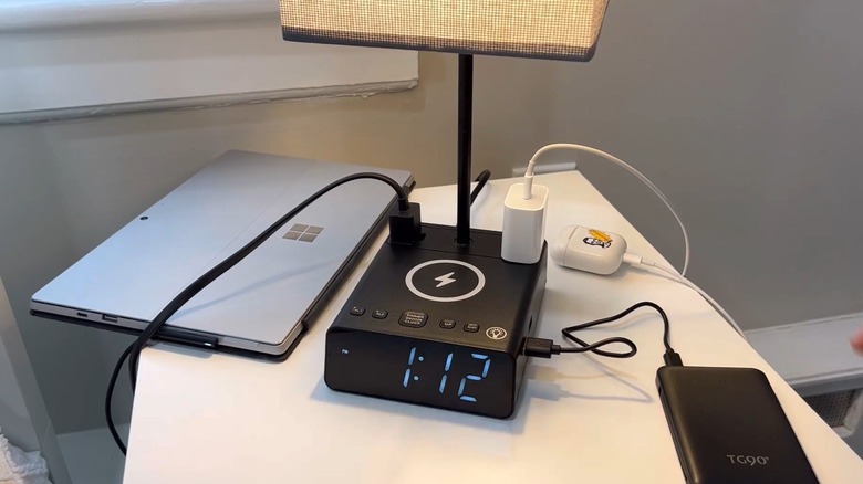 alarm clock lamp on nightstand with integrated USB and wireless charging