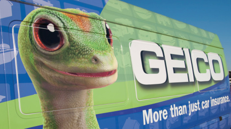 Geico name and mascot on the side of a van.