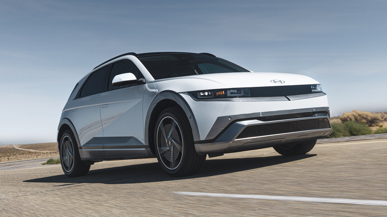 Hyundai Ioniq 5 on the move, seen from front 3/4 angle, white exterior