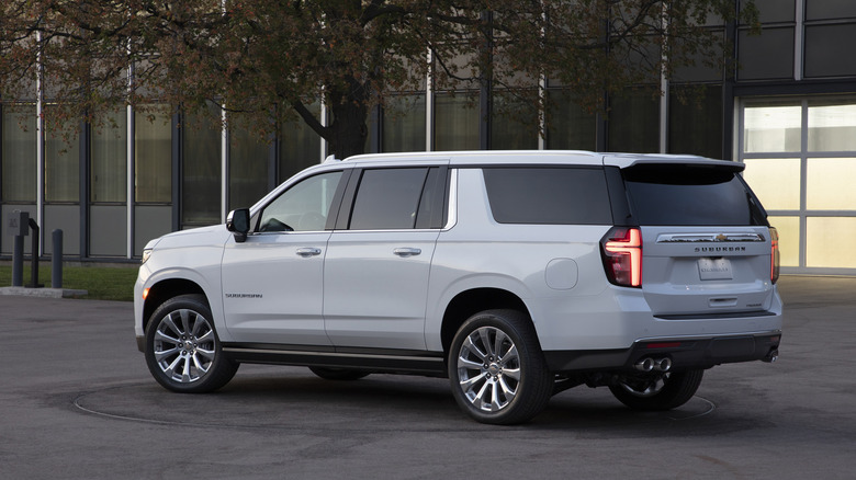 2021 Chevrolet Suburban parked in front of urban building, rear-left view