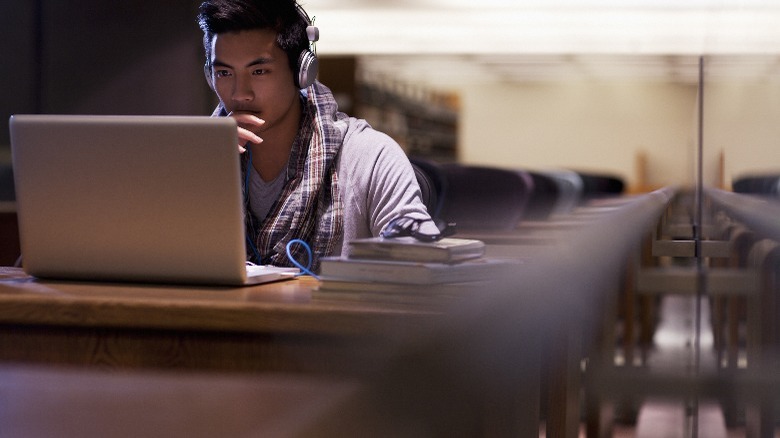 Focused man using a laptop