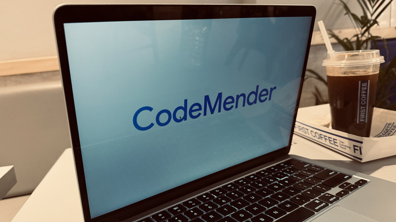 Google CodeMender logo on a laptop screen.