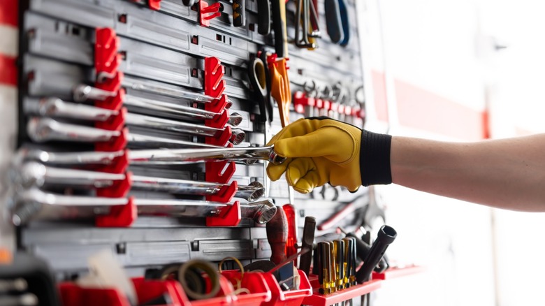 An assortment of mechanic's tools including wrenches, screwdrivers, and pliers.