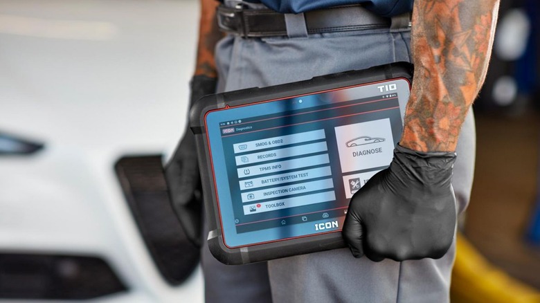 A person carrying the icon t10 professional diagnostic scan tool
