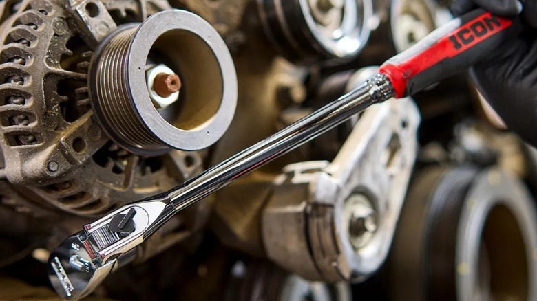 Icon G2 3/8-inch Drive, 14-inch Long Locking Flex Ratchet in front of engine