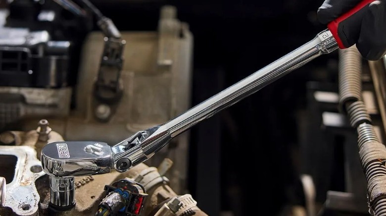 Icon G2 3/8-inch Drive, 14-inch Long Locking Flex Ratchet being used to tighten a bolt