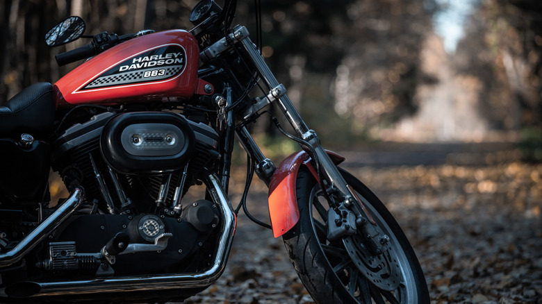 An orange Harley-Davidson Sportster 883 Roadster