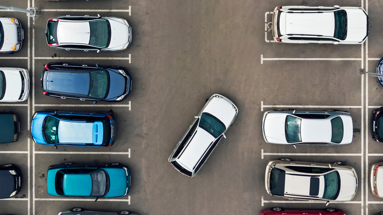 Various cars in a parking lot