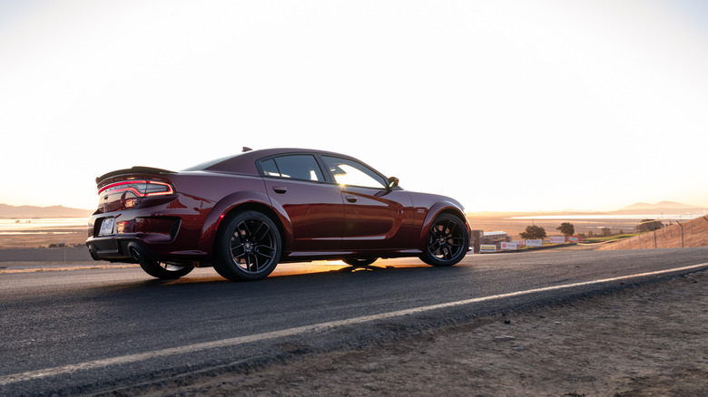 2022 Dodge Charger driving on racetrack, right-side view