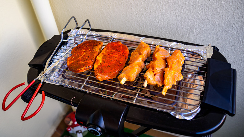meat being cooked on an electric grill