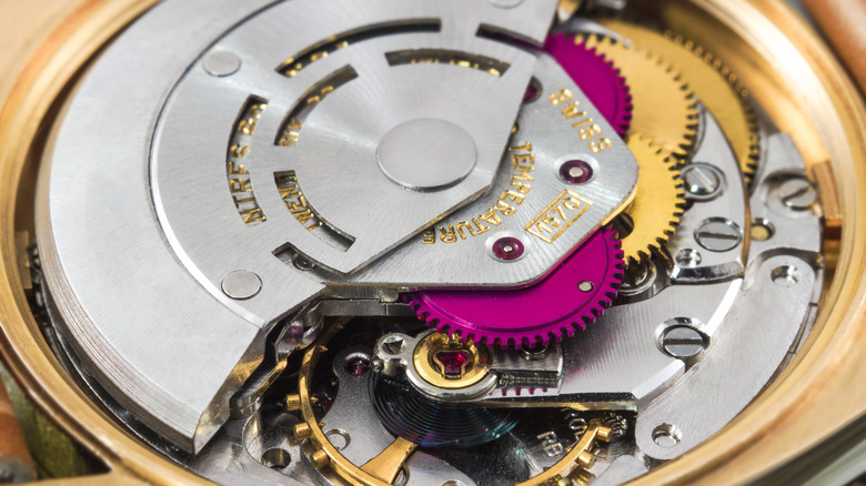 The internal mechanisms of a Rolex watch.