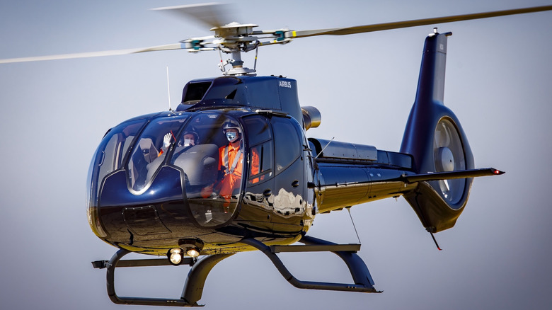 An Airbus H-130 helicopter flying