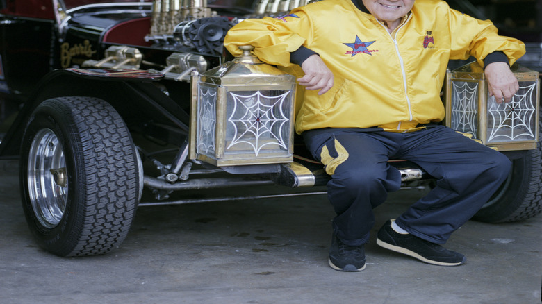 Car customizer George Barris seated at the front of the Munster Koach