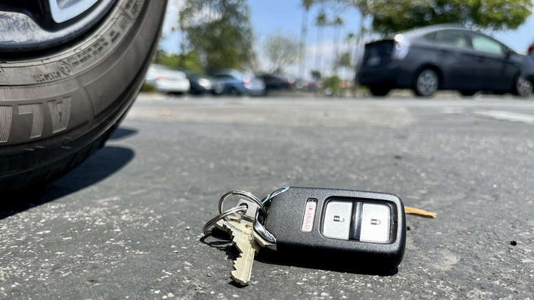 A key fob left on the ground in a parking lot