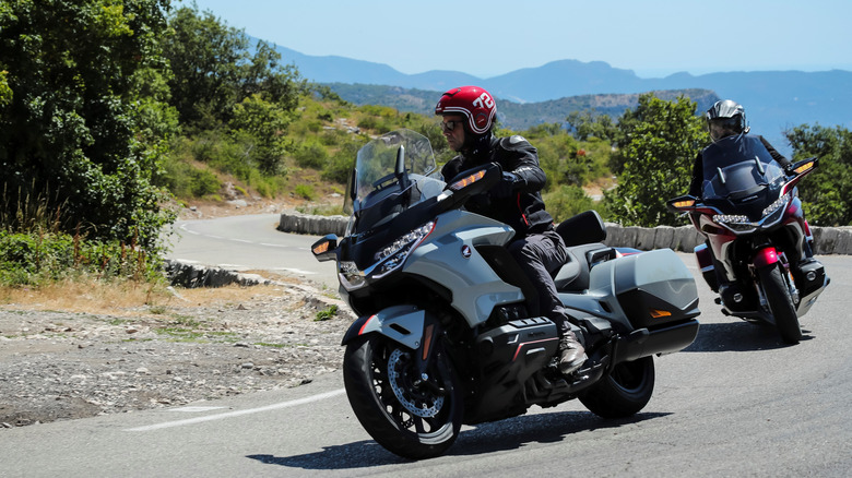 Two bikers siiting on a 2021 Honda Gold Wing motorcycle