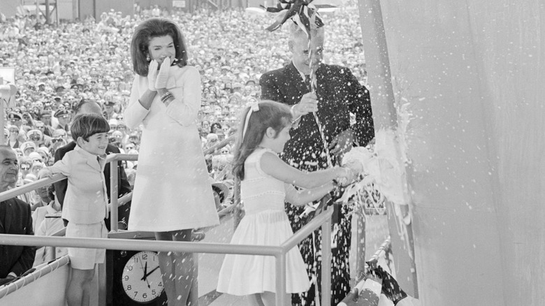 Caroline Kennedy christens a new aircraft carrier named after her father, John F. Kennedy