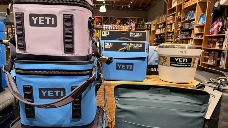 Yeti coolers and other products on display in a store