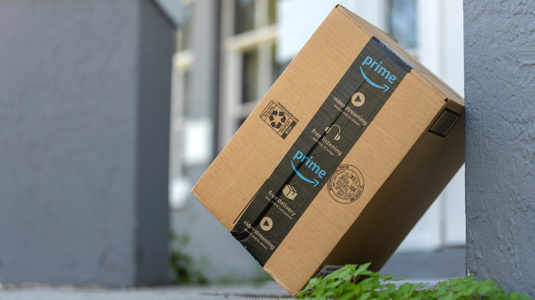 An Amazon box leaning against a wall