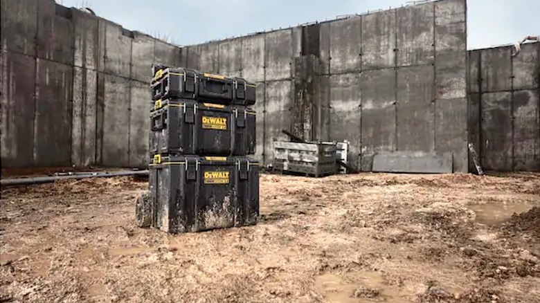 DeWalt Rolling Tool Box sitting in mud at construction site