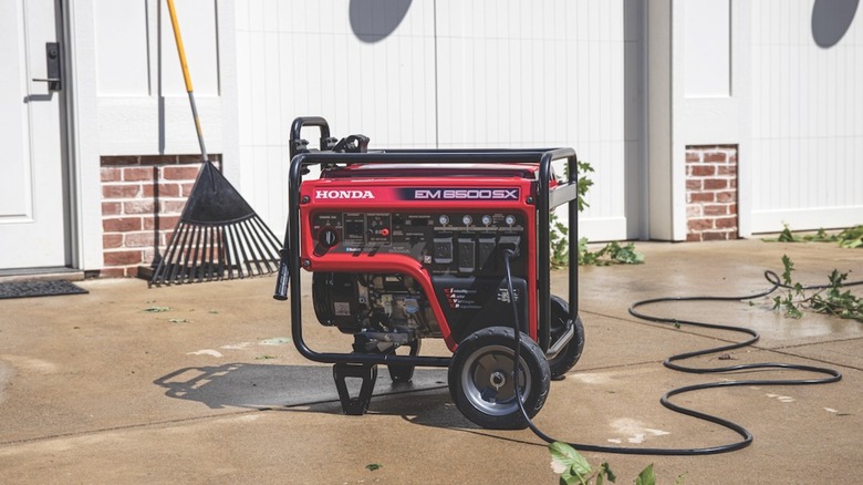 A 6,500-watt Honda generator set up in a driveway.